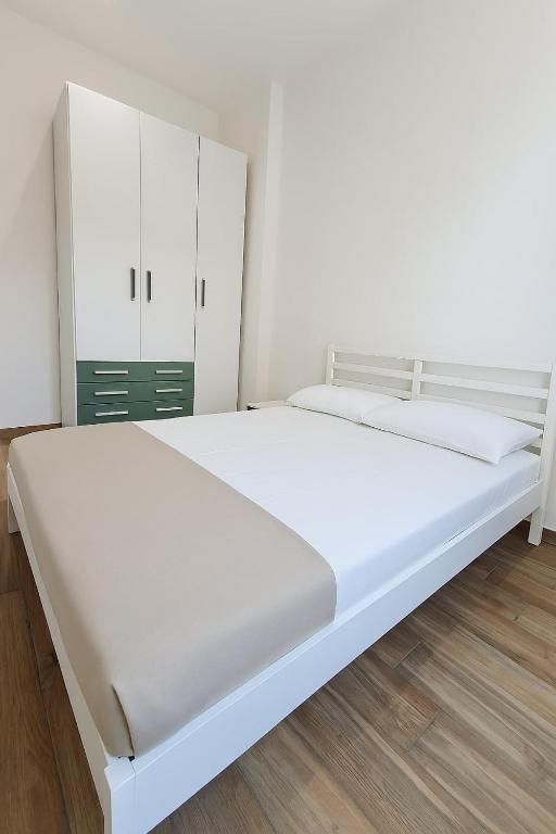 Bedroom with three-door wardrobe