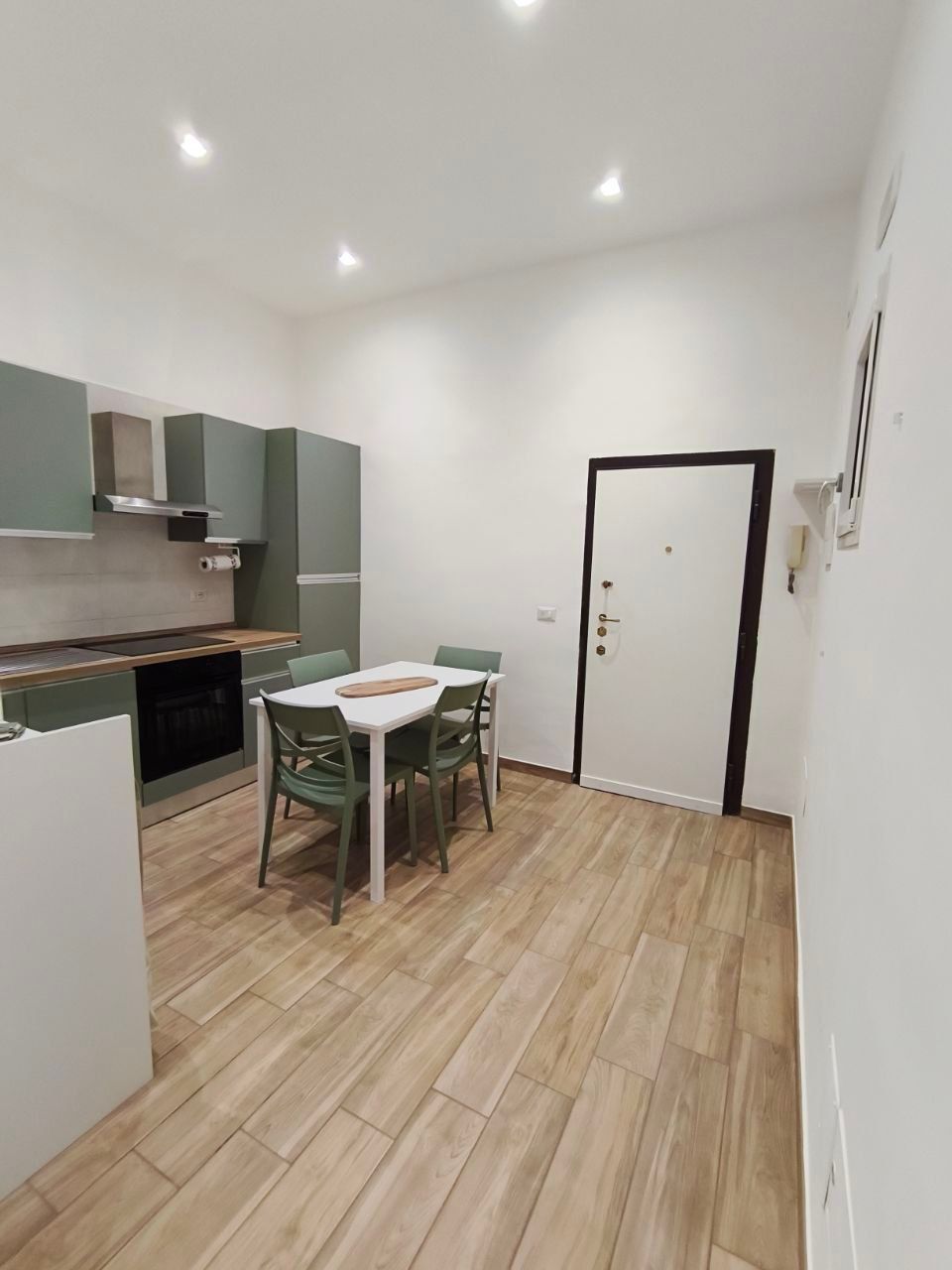Entrance with kitchen and security door